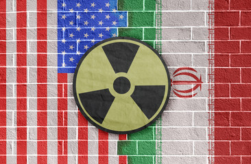 Iranian and american flags and radiation sign. Middle East conflict image