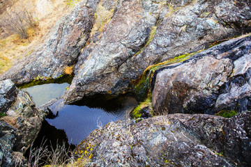  waterfall flowing through big rocks
