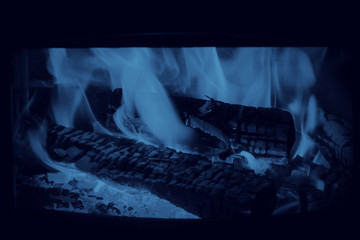 Fire in the fireplace Color of the year 2020 classic blue Toned Can be used for texture or background