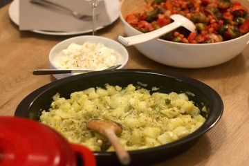 Mashed potatoes with olive oil, lemon and scallion, served on the table. Selective focus.
