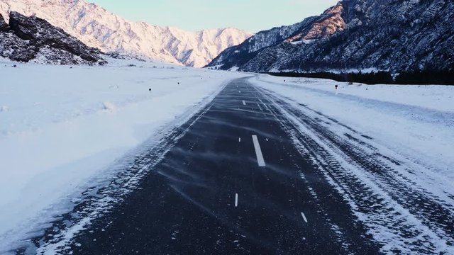 snow drifting snow on the highway in the mountains