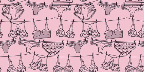 Vector lingerie pattern in pink and black. Simple outline bra & panties string of laundry hand drawn made into repeat. Great for background, wallpaper, wrapping paper, packaging, fashion.