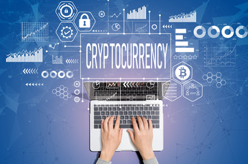 Fototapeta na wymiar Cryptocurrency theme with person using a laptop computer