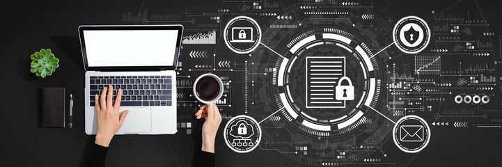 Data protection concept with person using a laptop computer