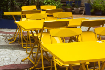 summer cafe with yellow tables and chairs, a place for lunch