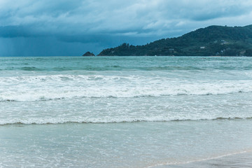 Beautiful seascape with cloudy sky, big waves on the sea. Summer in Thailand