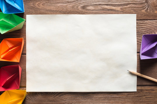 Concept of inspiration and creativity with paper ships. Place your text