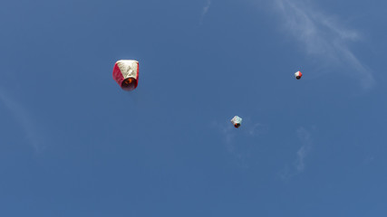 Shifen, Taiwan - SEP 14, 2019: Floating lanterns in blue sky background.