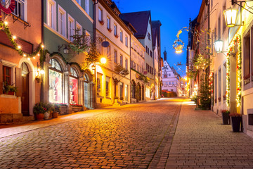 Fototapeta na wymiar Decorated and illuminated Christmas street and Market square in medieval Old Town of Rothenburg ob der Tauber, Bavaria, southern Germany