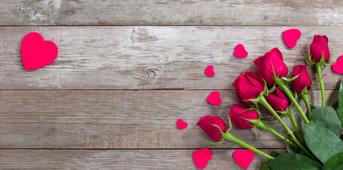 Roses and pink heart on old table. Backgrounds for special days  ( Valentine's Day, Wedding anniversary, birthday and dating )