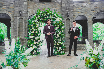 Handsome and elegant groom on wedding ceremony with wedding host