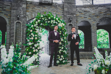 Handsome and elegant groom on wedding ceremony with wedding host