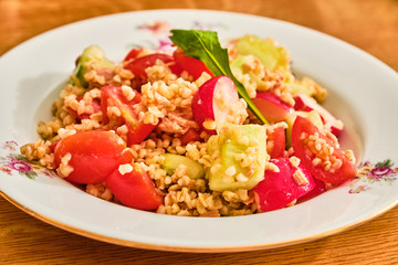 Bulgur salad on white plate