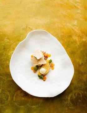 Cloudberry dessert served on plate