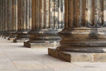 Architectural detail of marble doric order columns in a row