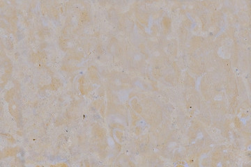 The texture of the Sandstone surface. Background of porous limestone stone of yellow color. Yellow-tone stone texture.