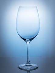 empty wine glass isolated on blue background