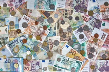 Currencies from around the world, collage of banknotes and coins