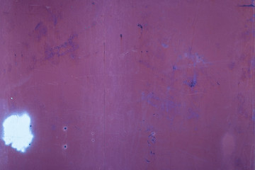 rusted metal surface with white patches