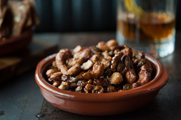 Roasted nuts in ceramic bowl