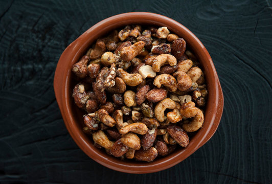 Roasted nuts in ceramic bowl