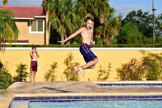 Boys have fun on vacation at a hotel pool