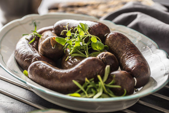 Roasted sausages in pan with rosemary. Traditional european food bratwurst jaternice or jitrnice