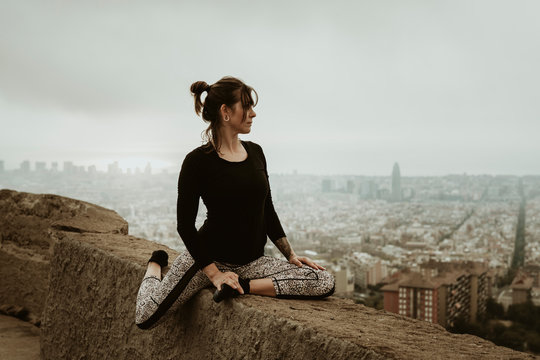 Young woman practicing yoga, stretching.Barcelona