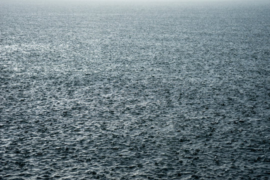 Rain pummels the waters surface on Jenny Lake