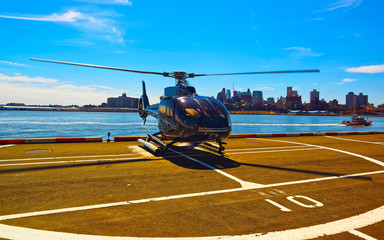 Helicopter landing at helipad. Skyline with Skyscrapers in Brooklyn Manhattan, New York City,...