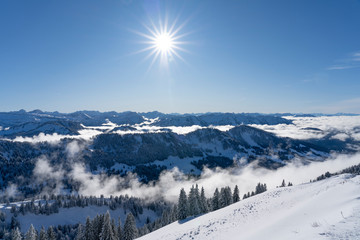 Winterlandscape in the Allgaeu Mountains, view from Hochgrat summit over a sea of fog to the...