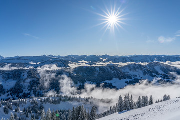Winterlandscape in the Allgaeu Mountains, view from Hochgrat summit over a sea of fog to the...