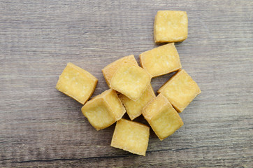 fried tofu vegetarian isolated on wooden table