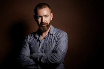 Fototapeta premium brutal man with a beard in the studio