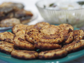 Fish diet. Fish table, XE salad of freshly salted river fish with olive oil, fish cakes, fried river fish on a wooden white rustic background or table.