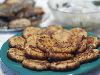 Fish diet. Fish table, XE salad of freshly salted river fish with olive oil, fish cakes, fried river fish on a wooden white rustic background or table.