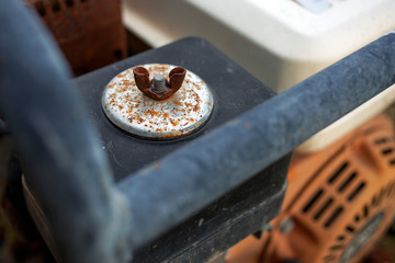 The rusty butterfly nut, screw nut for fastening the steel parts.
