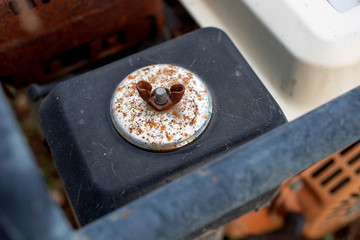 The rusty butterfly nut, screw nut for fastening the steel parts.