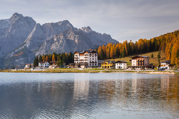 Dolomites mountains reflected in the Lago mi Misurina Lake at autumn, South Tyrol. Italy