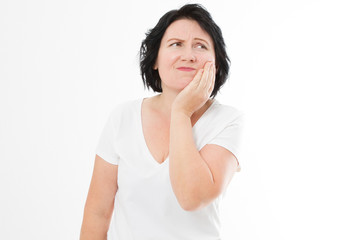 Attractive woman in her 40s pressing her bruised cheek with a painful expression as if she's having a terrible tooth ache. Middle age woman with toothache copy space