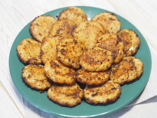 Fried pike of river fish with pumpkin. Wooden rustic table.