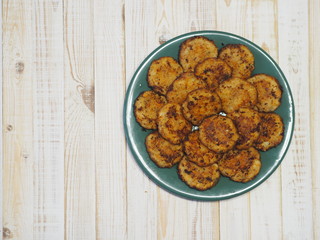 Fried pike of river fish with pumpkin. Wooden rustic table.