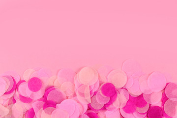 Background with pink paper confetti at bottom border and copy space above