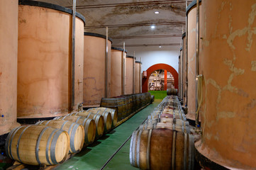 Traditional winery bodega on south of La Palma island with steel or concrete casks and wooden barrels in wine cellars, wine production on Canary Islands, Spain © barmalini