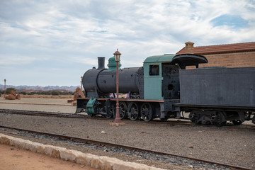 Fototapeta na wymiar Train and carriages on the Hijaz Railway line at Mada'in Saleh (Hegra), Al Ula, Saudi Arabia 