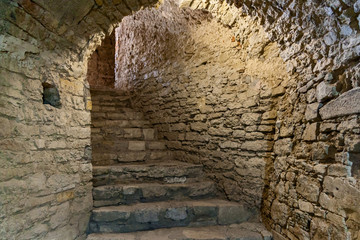Obraz premium Old stairs to the basement of the fortress
