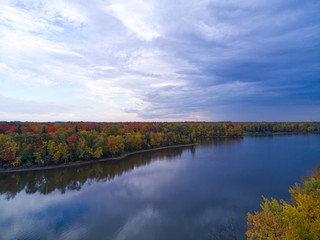 Naklejka premium Aerial landscape with river and dark blue stormy clouds 
