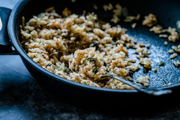 Turkish Stuffed Rice with Currants for Preparing Dolma in Pan with Spoon / Pilav or Pilaf