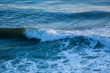 Obraz na płótnie Canvas Ocean waves at Sunrise