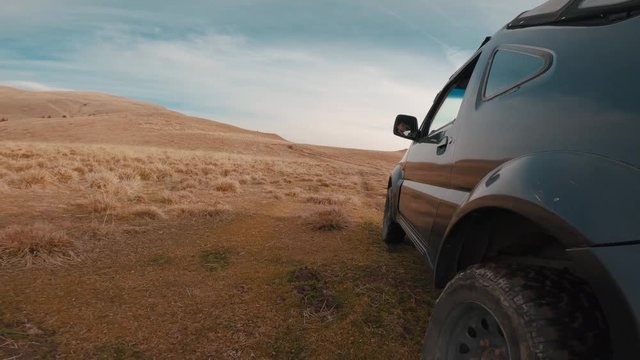 Point of view off-road car driving on a mountain road